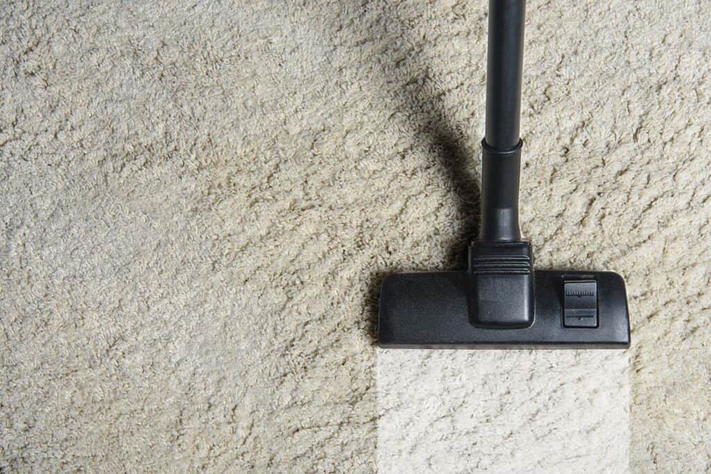 professional carpet cleaner vacuuming a carpet in Barking