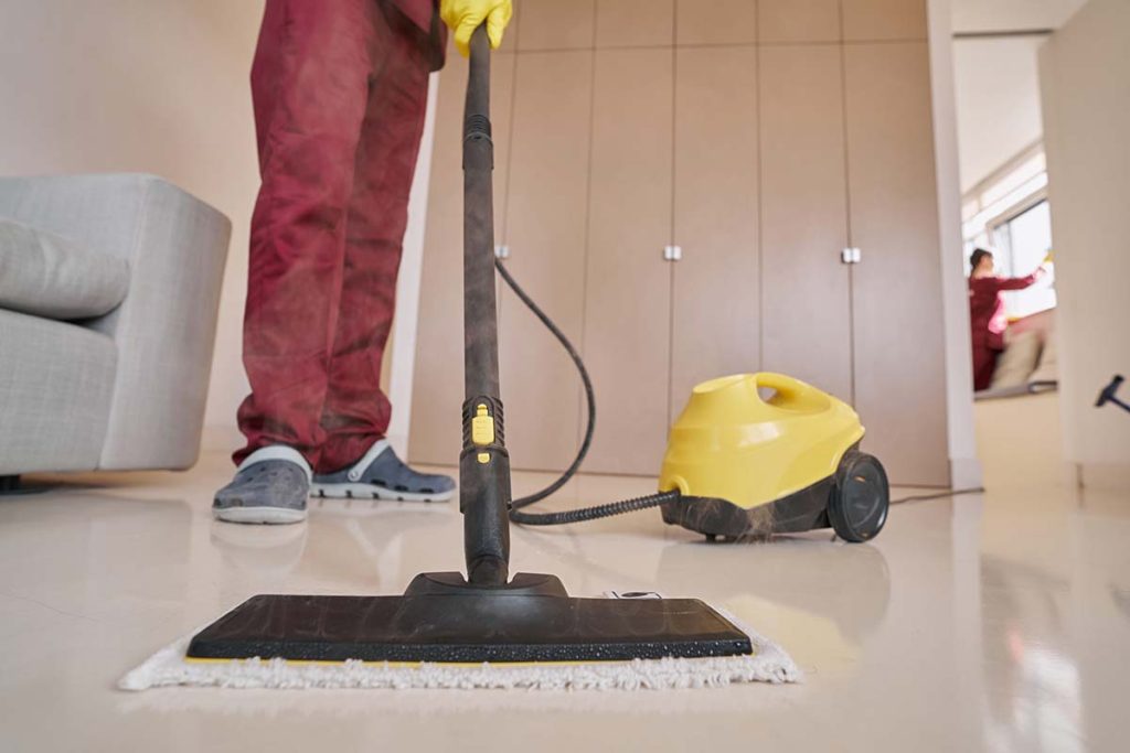 cleaner moppoing a floor in guildford