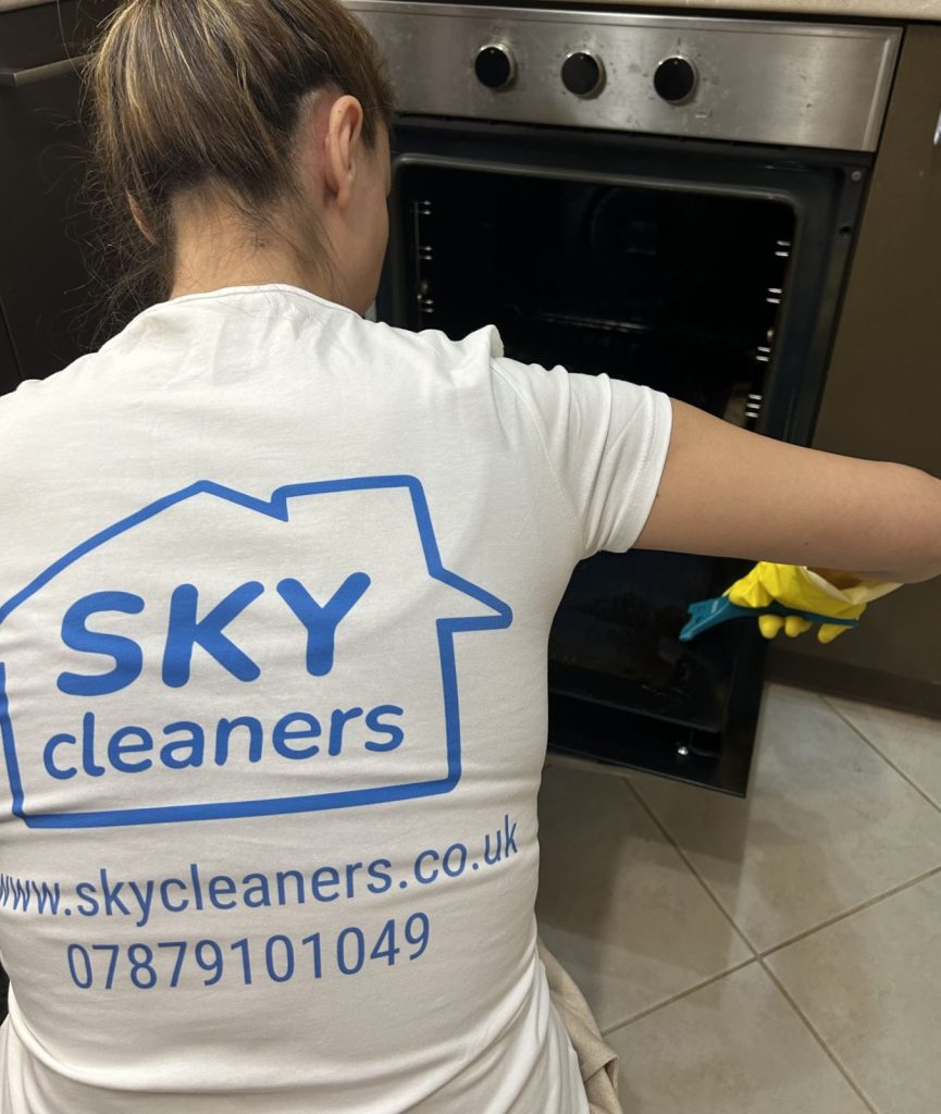 cleaner from skycleaners cleaning an oven